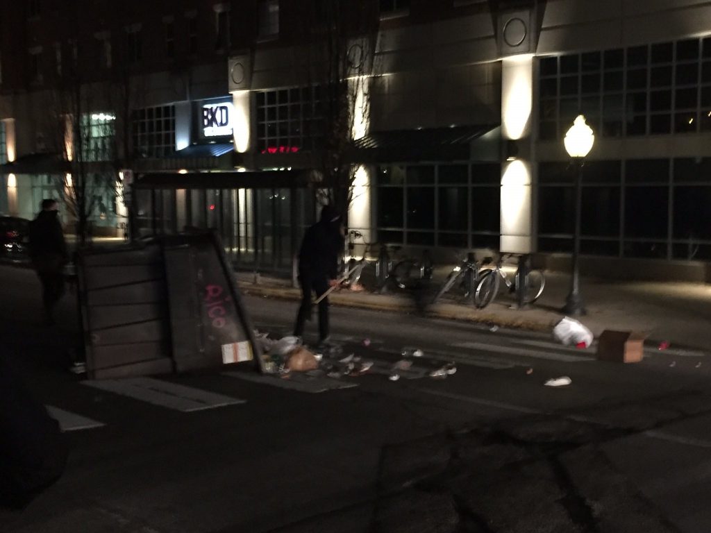 Dumpster tipped over in the street